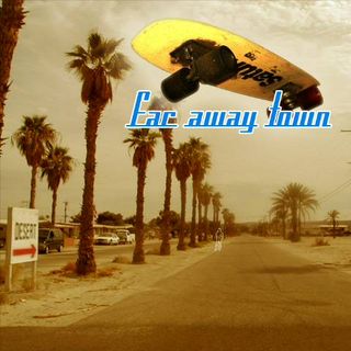 Photograph of a dusty road leading straight forward into the picture. Palm trees along the road. In foreground on the very left of the image a sign saying "Desert", a red arrow pointing to the right underneath. Right top corner features an old school skateboard